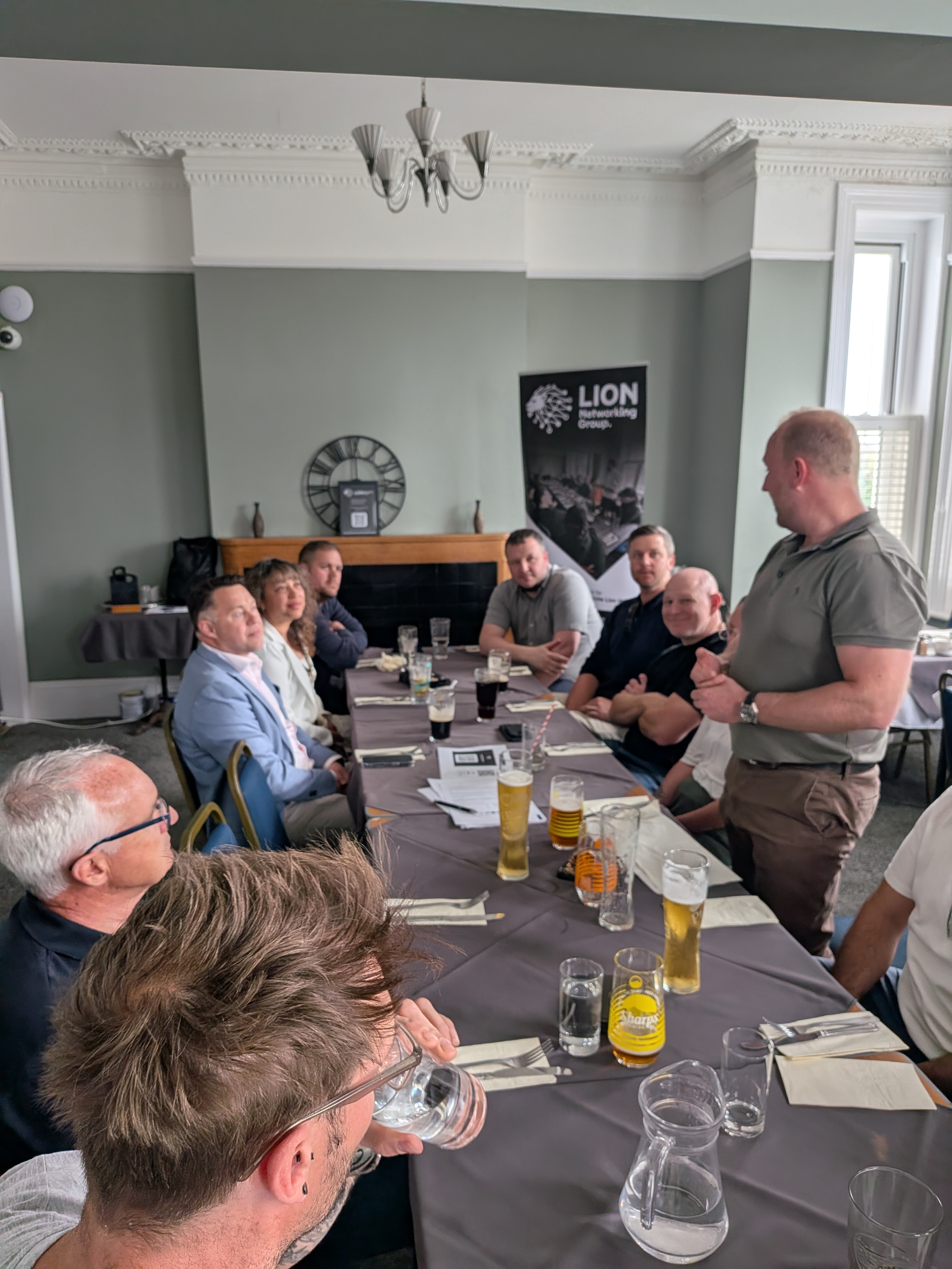 Local business owners networking around a table